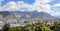 AERIAL: Picturesque view of the city of Lhasa under the rocky mountains of Tibet