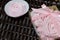 Aerial pink cherry marshmallows. In the form of a rose. In a gift box with a transparent cover. Against the background of wicker