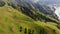 Aerial point of view. Top shooting angle, green mountains and trees, vertical panorama to the tops of the mountains and