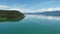 Aerial of pontoon boat on Flathead Lake, Montana on calm sunny summer day 4K.