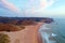 Aerial on Praia Amado on the west coast in Portugal at sunset