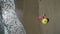 AERIAL: Pretty young woman sunbathing on beach