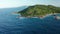 Aerial pull back and tilt up from southern coast of La Digue island