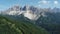 Aerial pullback of Dolomites in South Tyrol. Flying over Forest