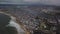 Aerial Pulling Away From Massive Slum on Beach