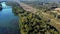 Aerial push over agricultural land adjacent to Catawba River approaching bridge and road