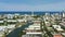 Aerial push in shot Miami Beach condominiums and apartments waterfront 4k