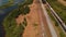 Aerial of railroad with a cargo train  and lakes