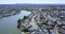 Aerial of residential properties riverside villas yachts alongside curved waterway