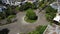 Aerial residential roundabout with tree in center