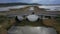 Aerial Reveal of exposed bridge in marshland, Narbonne, France