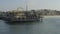 AERIAL: Reverse flight looking at Santa Monica Pier in Los Angeles, California, Sunny, Blue Sky