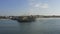 AERIAL: Reverse flight looking at Santa Monica Pier in Los Angeles, California, Sunny, Blue Sky