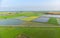 Aerial: rice paddies, flooded cultivated fields farmland rural italian countryside, agriculture occupation, sprintime in Piedmont,