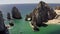 Aerial, rising, tilting towards the Arch of Cabo San Lucas, Mexico