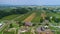 Aerial Rising View of a Corn Maze and Fertile Farmlands with a Railroad Track Traveling Thru