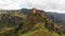 Aerial rising view dramatic landscape with historical Tmogvi fortress ruins with old wall o