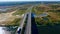 Aerial road traffic. Aerial view road above river landscape. Highway landscape