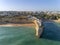 Aerial rocky famous seascape cape and Senhora da Rocha church. Algarve.