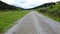 Aerial rural forest road and meadow at a cloudy day 2 - video footage