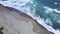 Aerial scenery of beach with frothy wave