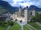 Aerial scenery of beautiful Stockalper Palace surrounded by green meadows