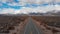 AERIAL: Scenic asphalt highway running through the rugged wilderness of Nevada.
