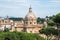 Aerial scenic view of Colosseum, Roman Forum in Rome and church