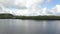 Aerial of `Secret beach` with a fisherman boat on it and mangrove forest in a distance