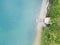 Aerial Serenity: Wooden Pier Leading to Clear Water Lake