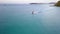 Aerial shooting young couple riding jetski on ocean, afternoon in exotic place