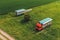 Aerial shot of apiary truck with colorful beehive wooden crates in trailer