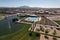 Aerial shot of the Arizona fountain park with swimming pool and new homes