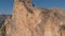 Aerial shot of base jumping from the top of the mountain in the Caucasus. Slow motion.