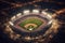 An aerial shot of a baseball stadium during a game, with the field illuminated by stadium lights, players in action, and fans