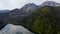 Aerial shot of beautiful alpine lake Ritsa speed boat floating summer, View from Above on Gorgeous Lake Ritsa between