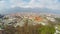 Aerial shot, beautiful city at bottom of mountains, Austrian Innsbruck in spring