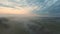 Aerial shot of beautiful countryside environment in early morning. Amazing scenic view on misty valley and horizon at