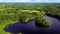 Aerial shot of beautiful islands at lake on a calm summer evening.