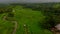 Aerial shot of a beautiful rice terraces on the Bali island. Drone moves upwards and rotates making a panorama