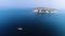 Aerial shot of the boat advancing in the blue waters of the Aegean Sea with a drone