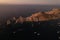 Aerial shot of the boats swimming in the azure sea at sunset in Baja California, Mexico