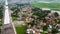 Aerial Shot. Bridge under construction and The edge of an urban river with houses