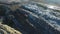 Aerial shot: bulldozer works with garbage at huge dump