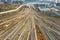 Aerial shot of a bustling cityscape featuring multiple railroads and train tracks