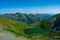 Aerial shot of the calm lake Capra in the beautiful Fagaras mountains located in Romania