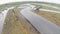 Aerial shot of cars drifting during drift competition named. Clip. Car race aerial view. Racing track and drifting cars