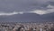 Aerial shot of a cityscape full of buildings and houses on a cloudy weather