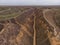 Aerial Shot of clay hills with canyons near the Black sea at Misty Autumn weather. Stanislavs mountains, Kherson region