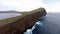 Aerial shot of a cliffed coast and Sorvagsvatn lake in Vagar, Faroe Islands